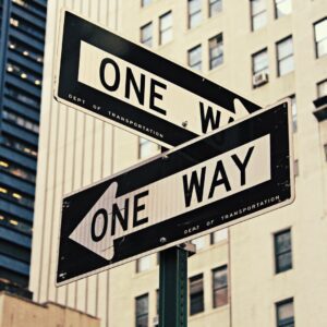 white and black One Way-printed road signages